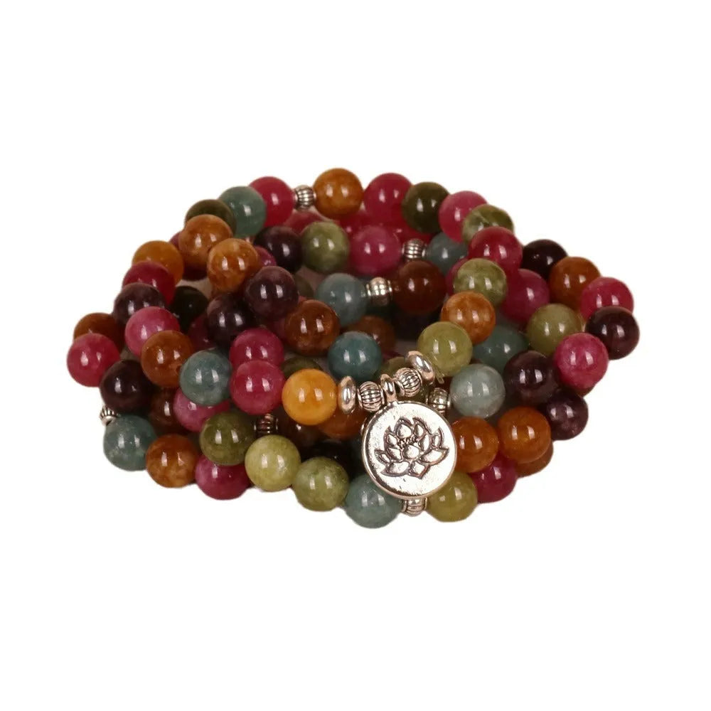 108-bead adjustable multi-layer bracelet with lotus charm in tourmaline colour, made from alloy.