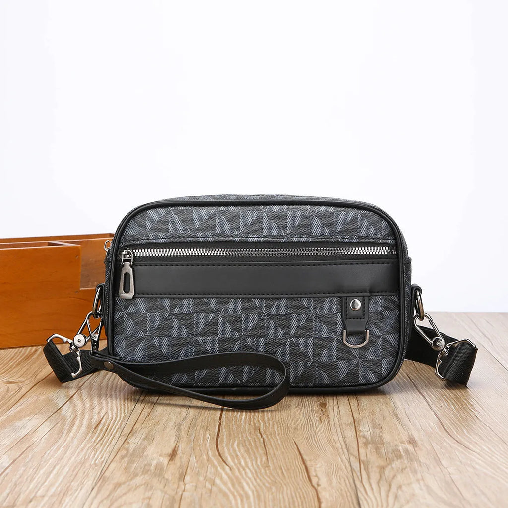Men's black casual shoulder messenger bag with geometric pattern and handheld strap.