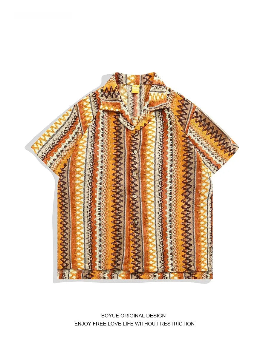 Loose fit ethnic style woven Cuban collar shirt in contrasting colours on a hanger.