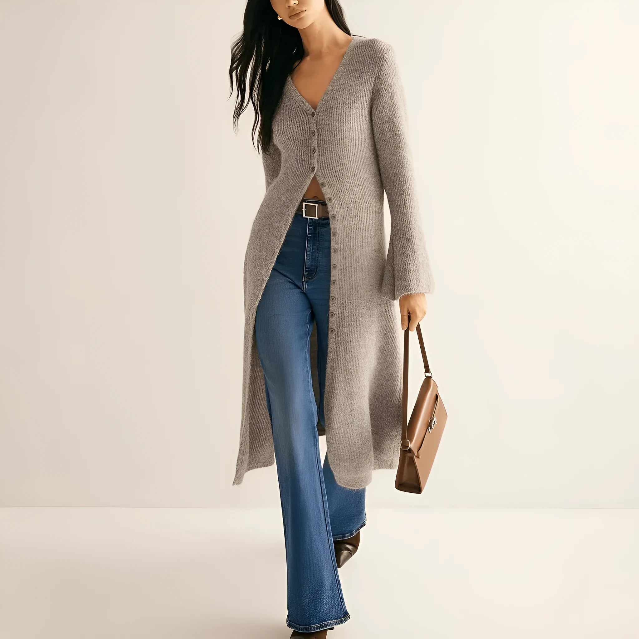 Khaki coloured women's long sleeve button-front cardigan coat on a hanger.