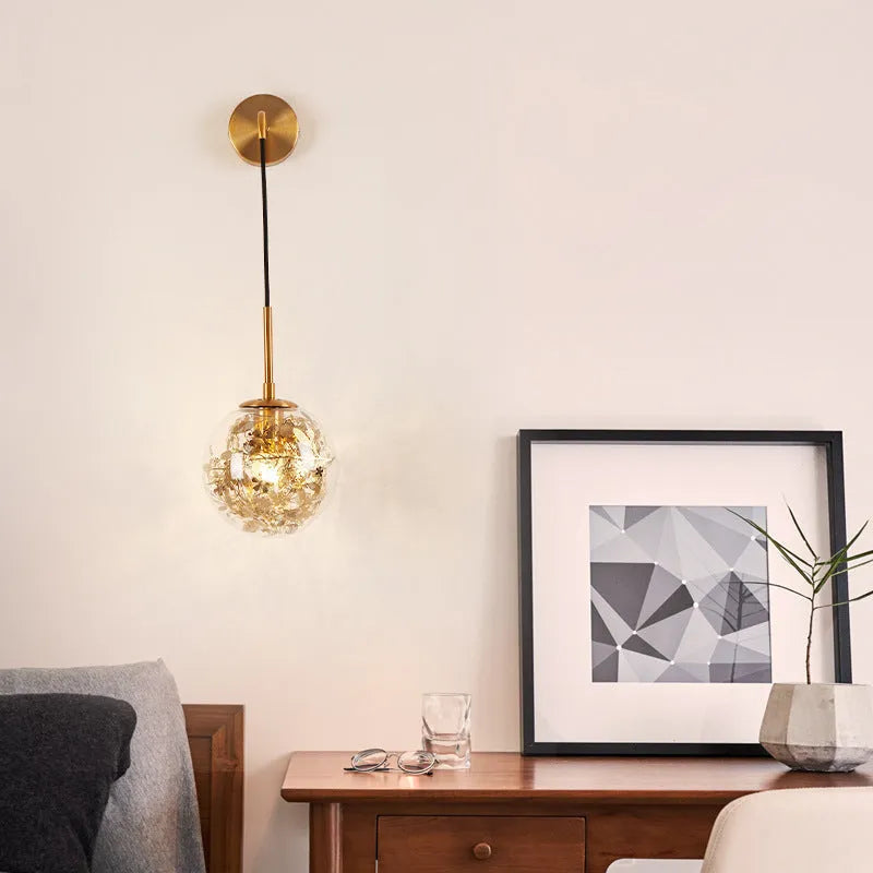 Glass bedside wall lamp with LED lighting in golden flower finish measuring 20cm diameter