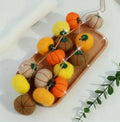 Wool felt pumpkin poke ornaments in autumn colours with 5cm diameter