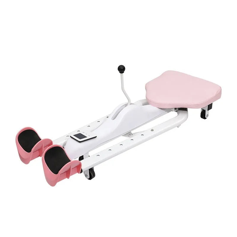 A pink leg stretching device with a steel frame and foam padding, shown on a gym floor.
