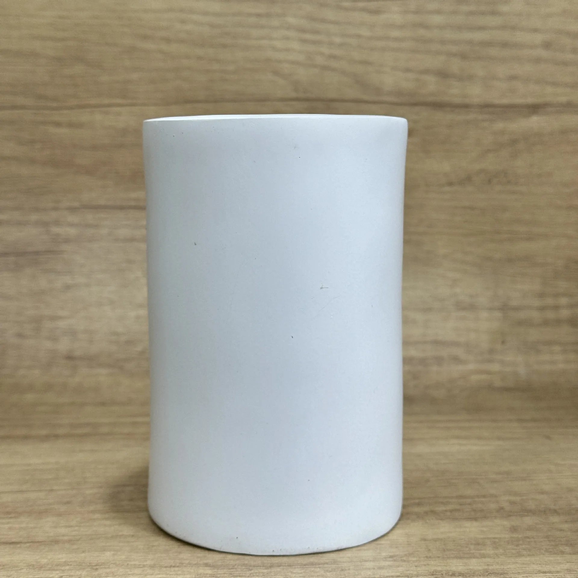 Resin tissue box holder with humorous design, dimensions 8.5cm by 14.6cm, on a desktop