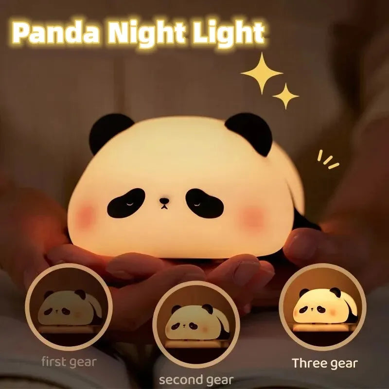 Panda-shaped night light with soft silicone surface, measuring 150x130x80mm, showing warm white glow