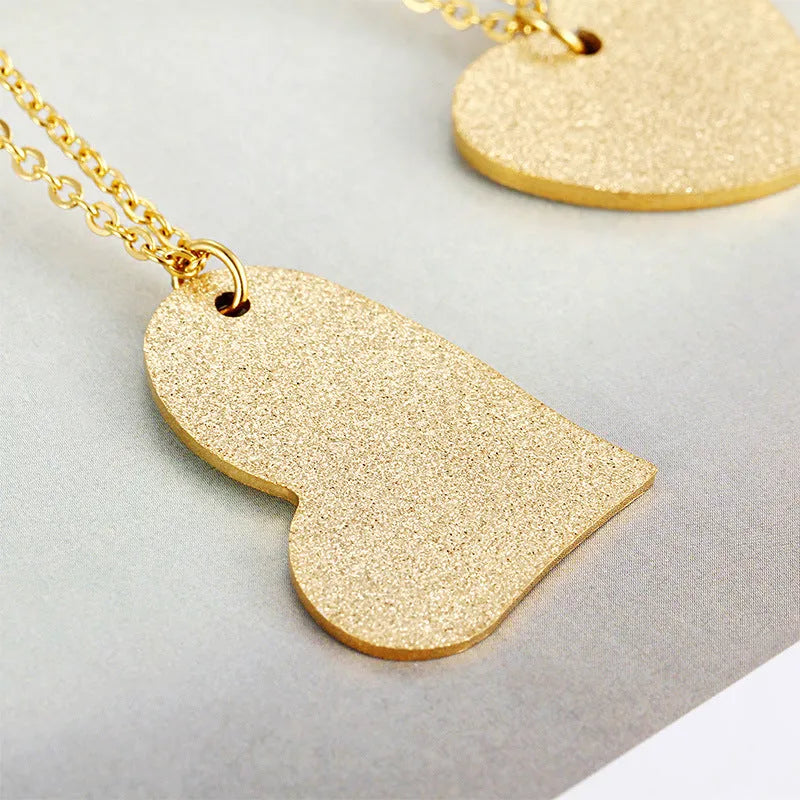Women's silver titanium steel necklace with a geometric heart pendant