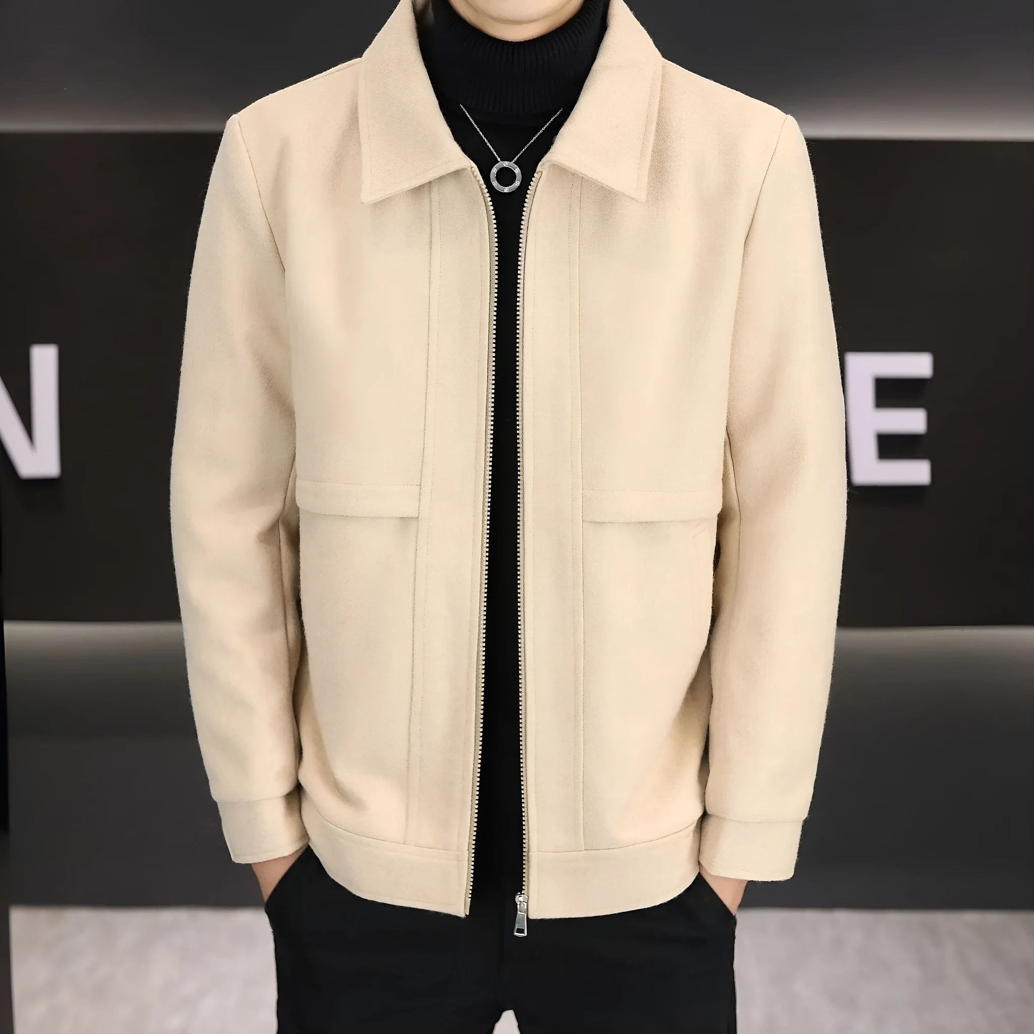 A man's khaki casual jacket with a polo collar and side seam pockets.