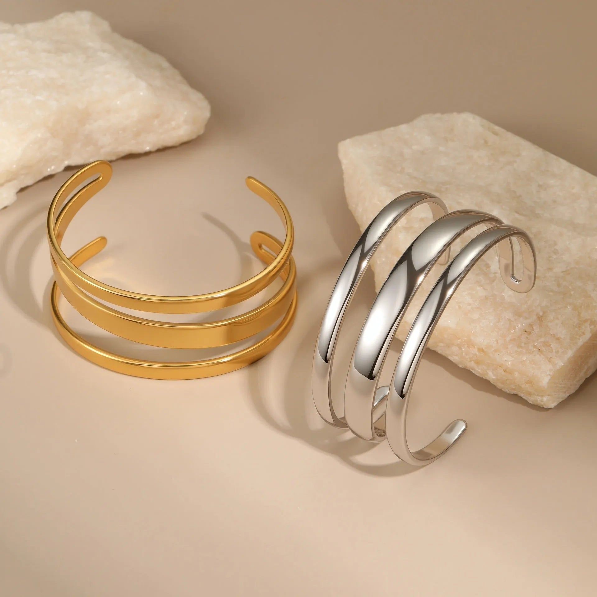 Stainless steel simple opening bracelet with geometric line design in gold or steel electroplated finish
