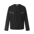 Man wearing a black loose-fit cotton long sleeve casual top.