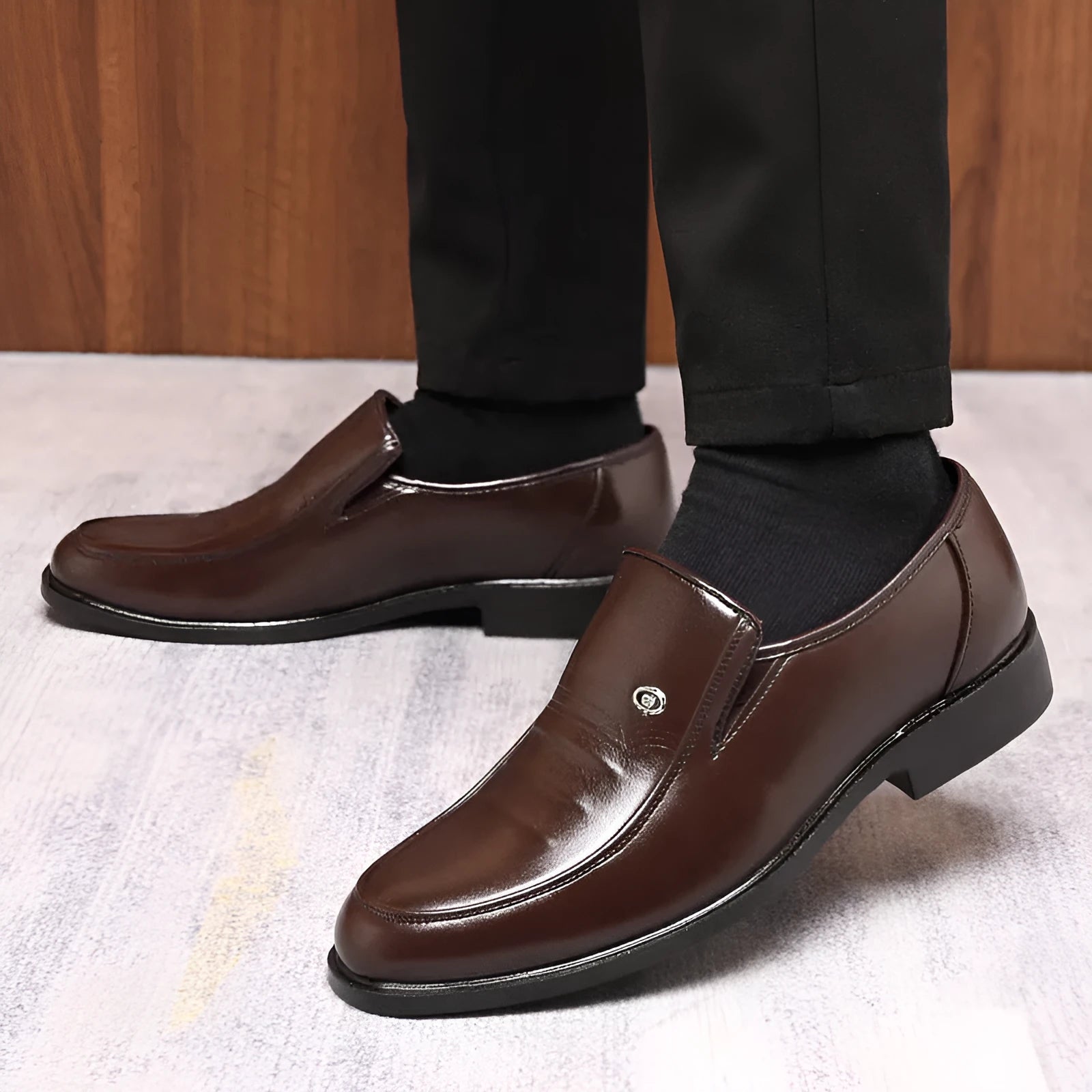 Men's black plus size casual shoe with a leather toe holder and rubber sole, shown from the side.