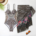 Women's leopard print one-piece swimsuit with a long mesh cover-up dress.