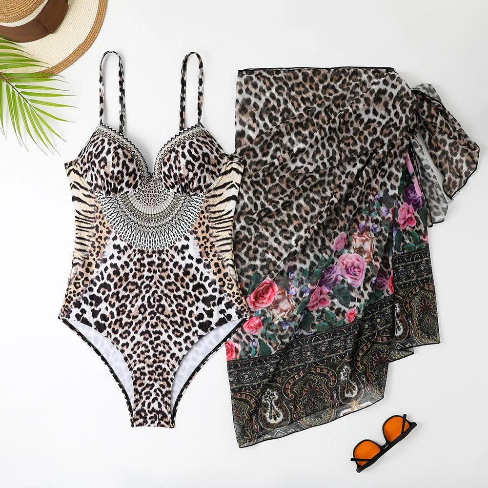 Women's leopard print one-piece swimsuit with a long mesh cover-up dress.