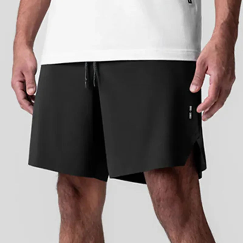 Men's grey seamless sports shorts with knee-length straight leg design and quick-dry fabric