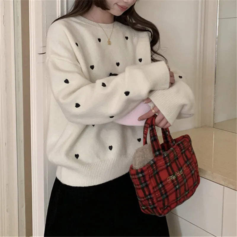 Women's acrylic pullover sweater with embroidery in milky white, loose fit for autumn and winter wear.