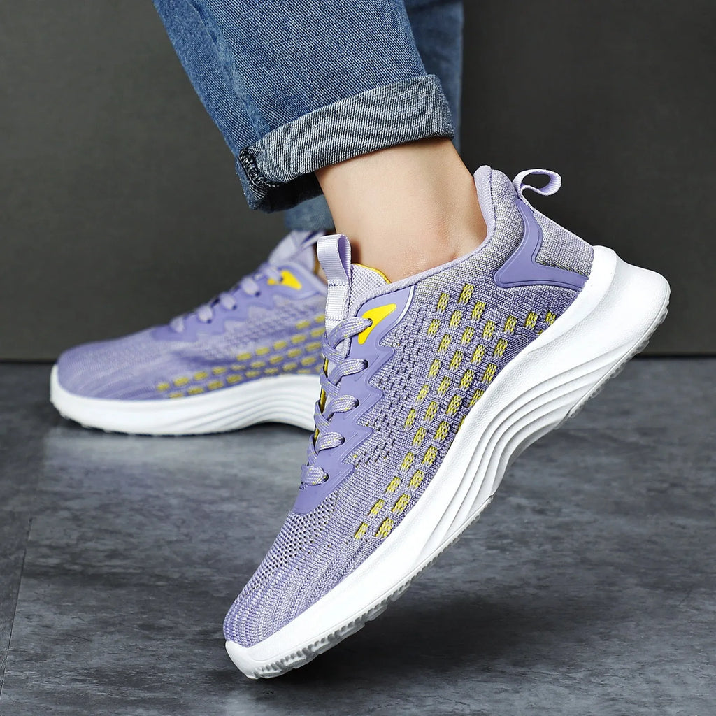 Women's lavender purple Flyknit running shoes with stripe pattern and mesh lining.