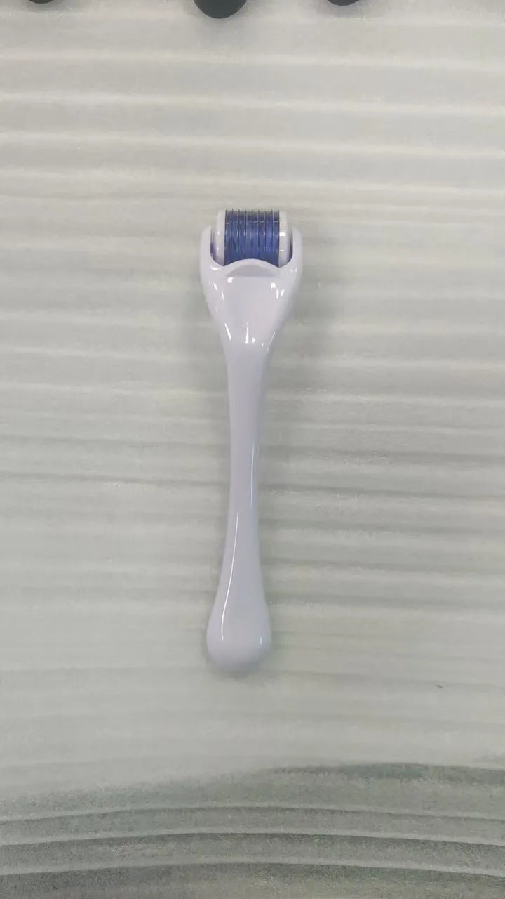 540 micro needle roller with PC handle and coloured wheel showing needle configuration for skin treatment