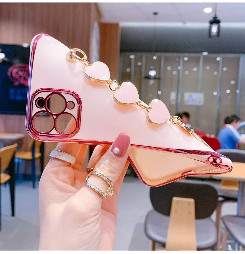 Solid colour silicone mobile phone case with an attached wrist strap for Samsung Galaxy smartphones.