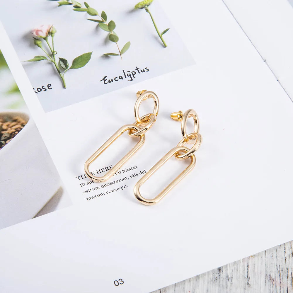 Sterling silver geometric hoop earrings with electroplated finish and needle post design