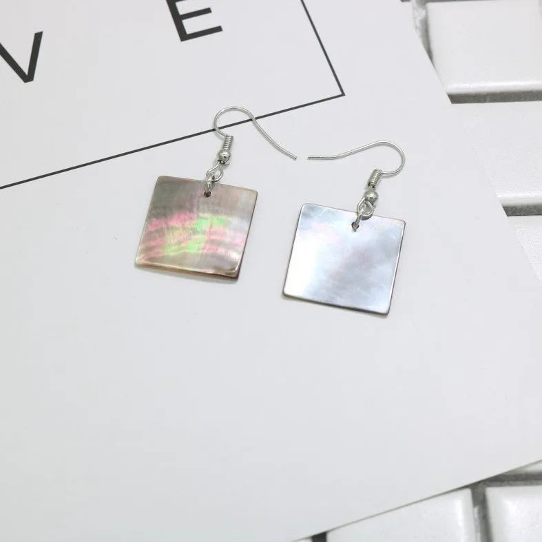 Women's geometric shell earrings in square and rectangular designs with natural shell material texture