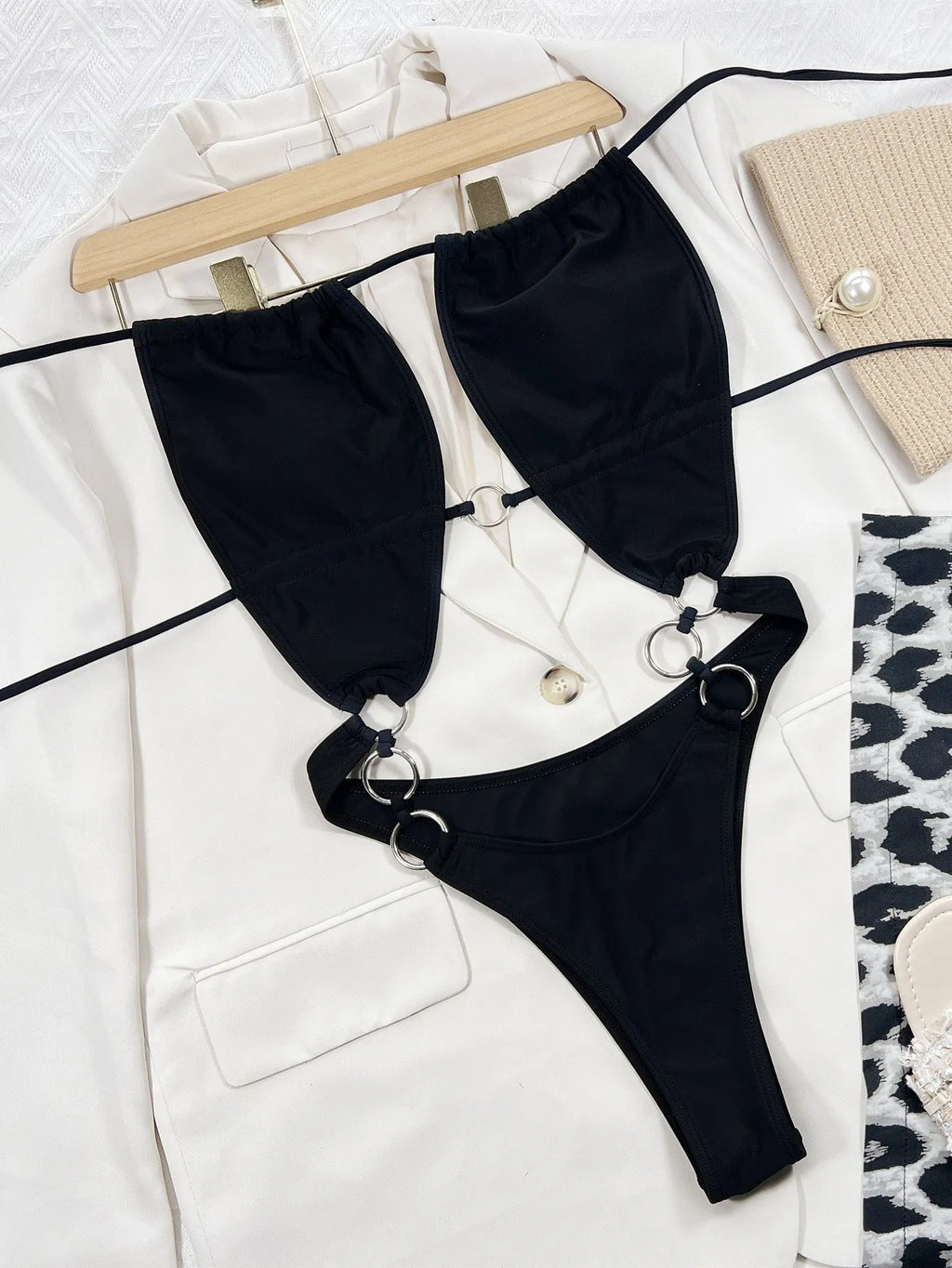 Black sleeveless one-piece women's swimming suit made from nylon fabric for swimming activities