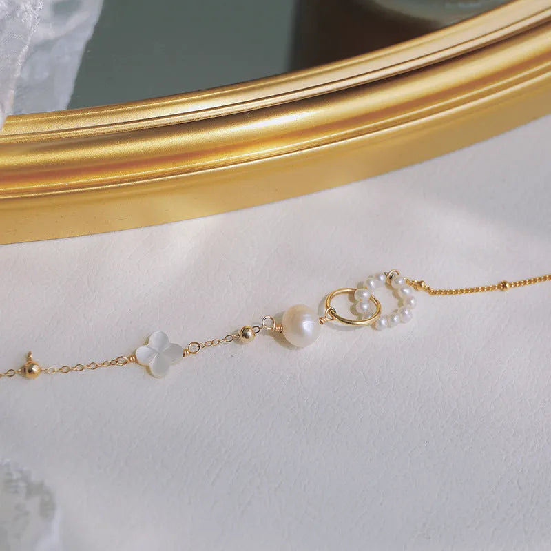 14k gold-plated natural pearl bracelet for women showing pearl and metallic elements