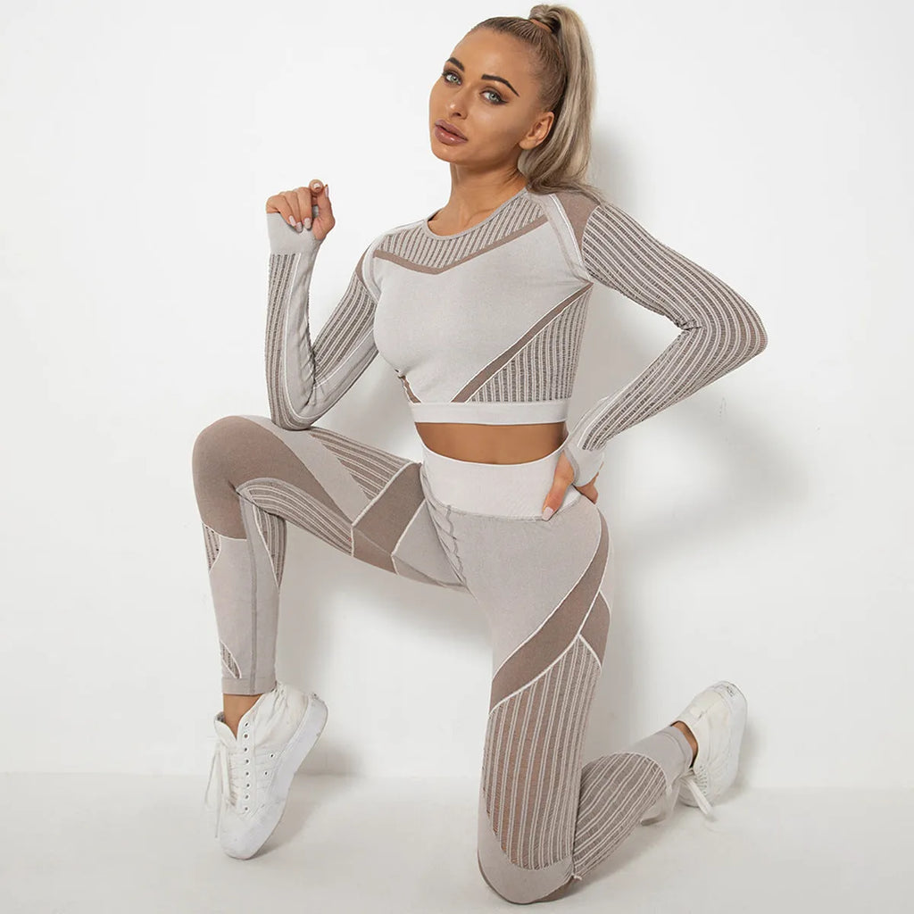 Women's long-sleeved seamless yoga suit in a striped pattern, shown in a stretch fabric suitable for exercise.