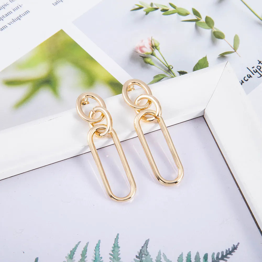 Sterling silver geometric hoop earrings with electroplated finish and needle post design