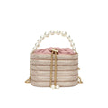 Women's round crossbody bag in soft PU with beaded details, adjustable strap, and zippered interior organiser.