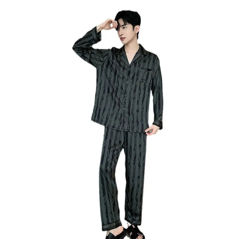 Men's black striped ice silk pajama two-piece set with V-neck top and long trousers.