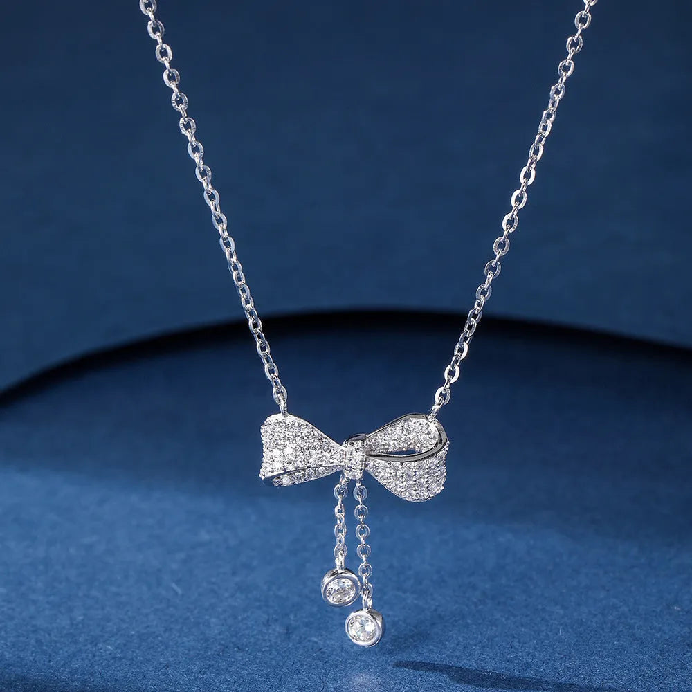 S925 sterling silver bow necklace with adjustable 40-45cm chain and electroplated silver finish