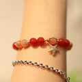 Handmade women's 8mm red agate and sunstone bracelet with xiangyun patterns in ethnic style