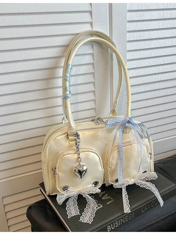Beige PU shoulder bag with double straps and sewing thread detailing, showing horizontal square shape