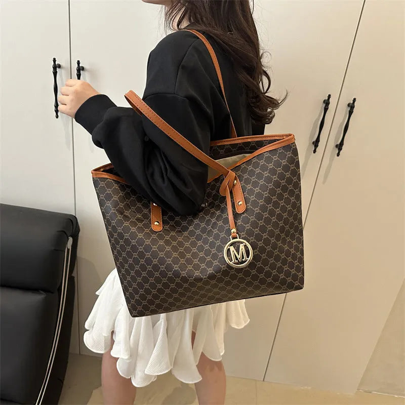 PU street style shoulder bag in black showing 42cm width and sewing thread detailing with polyester lining