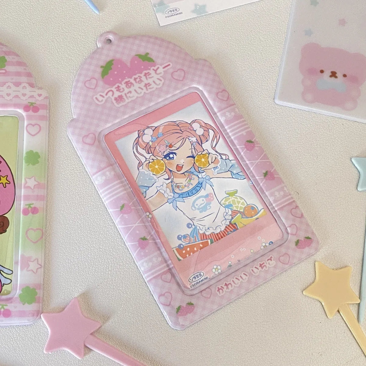 Plaid strawberry PVC card holder with 3-inch cartoon motif, measuring 7.6 by 13.6 cm