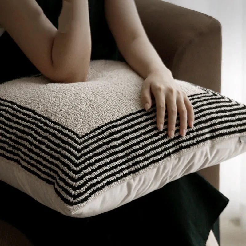 Black and white geometric patterned square and waist living room cushions with towel embroidery.