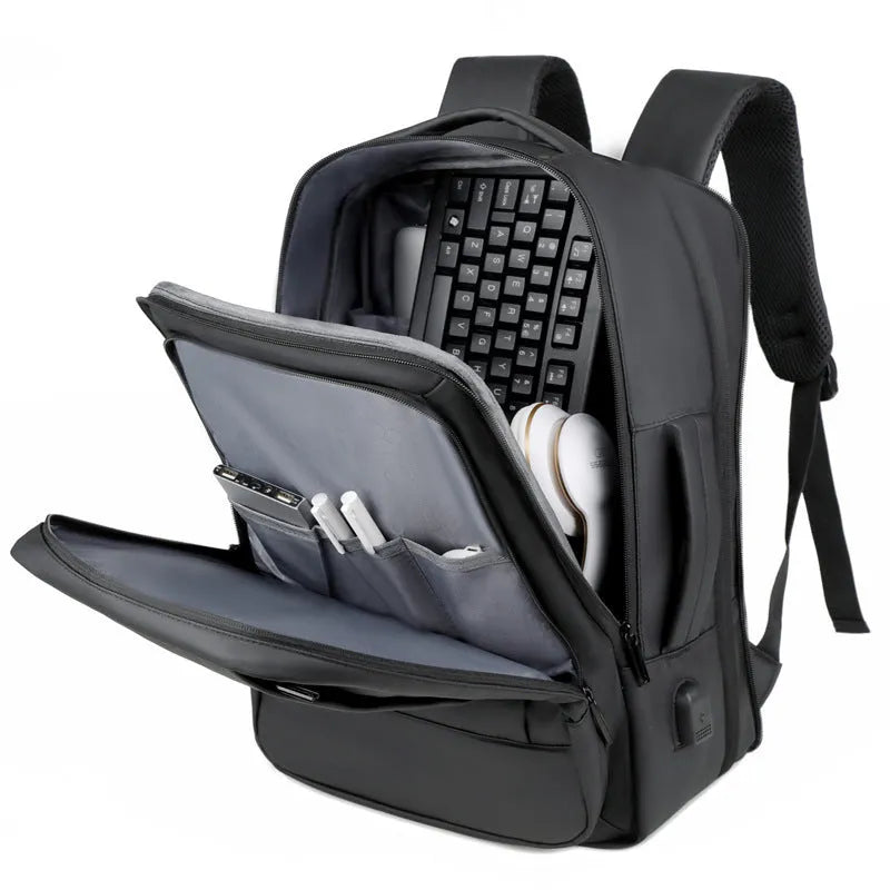 Black waterproof business backpack with 20-35L capacity and curved shoulder strap for commuting