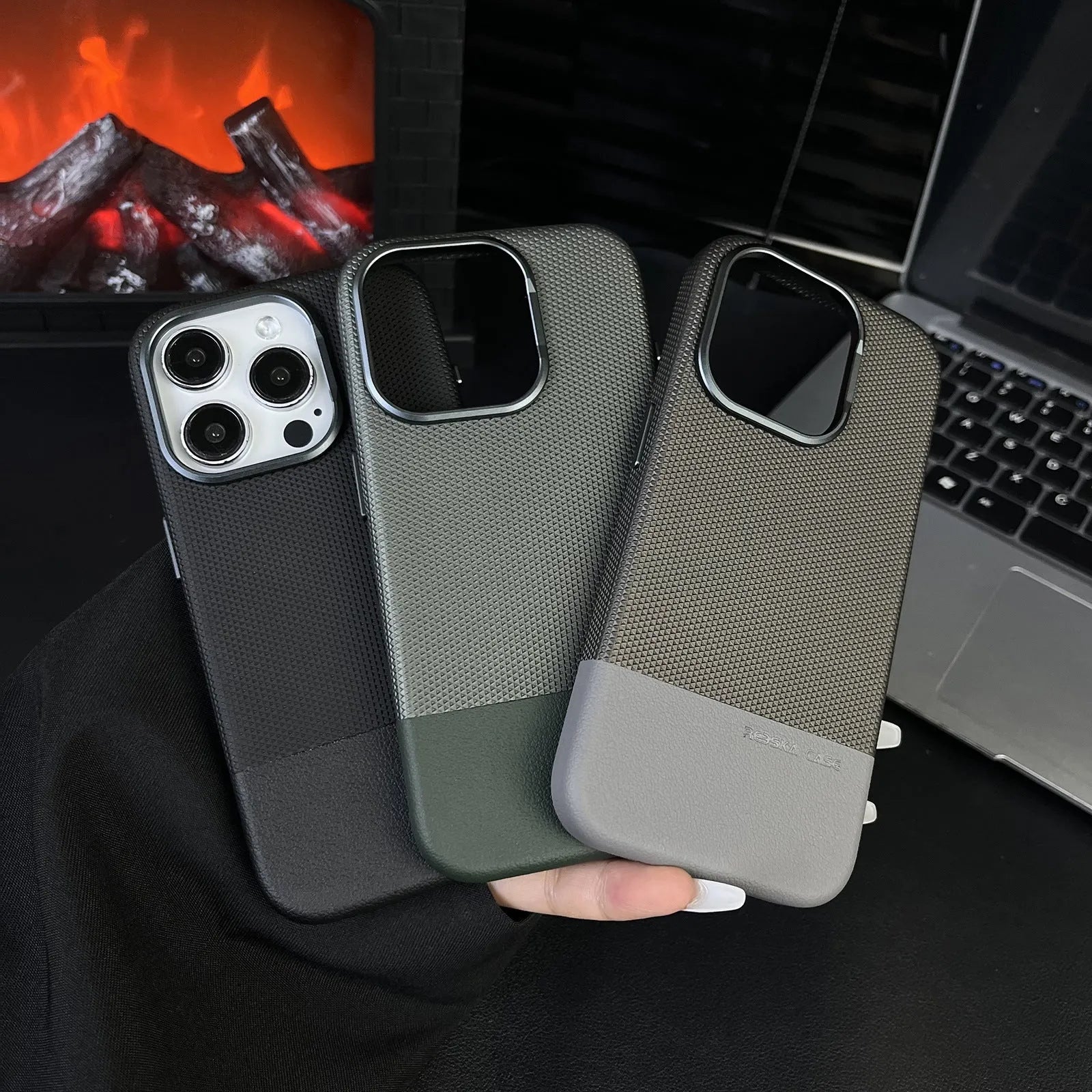 iPhone magnetic phone case with dragon scale texture and stitching detail in black, grey and green colours