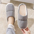 Down cotton slippers with artificial leather upper, rubber anti-slip soles, and plush lining in blue, green, grey, pink, or yellow