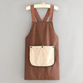 Waterproof kitchen apron in black colour, made from polyester with free-size design