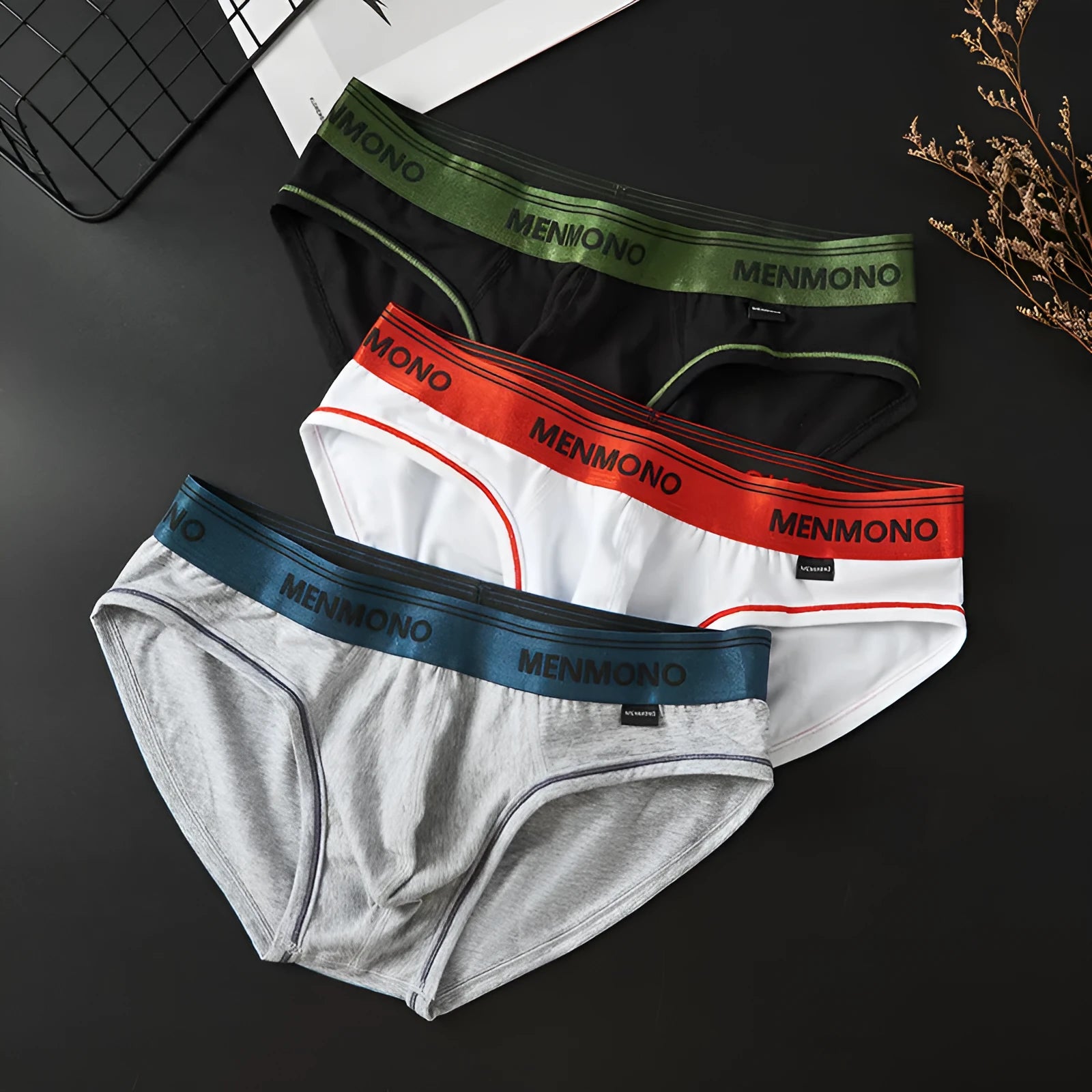 Men's low-waist cotton briefs in solid colours with a briefs style, showing breathable fabric and low-waist design.