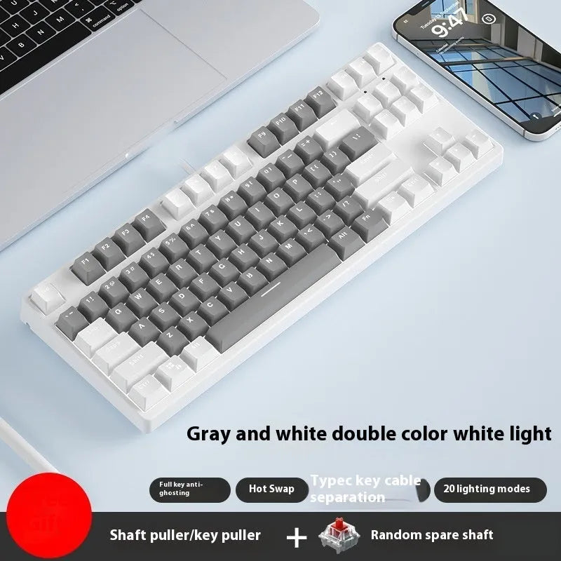 87-key wired mechanical keyboard with two-tone keycaps and metal frame, showing compact design and included tools
