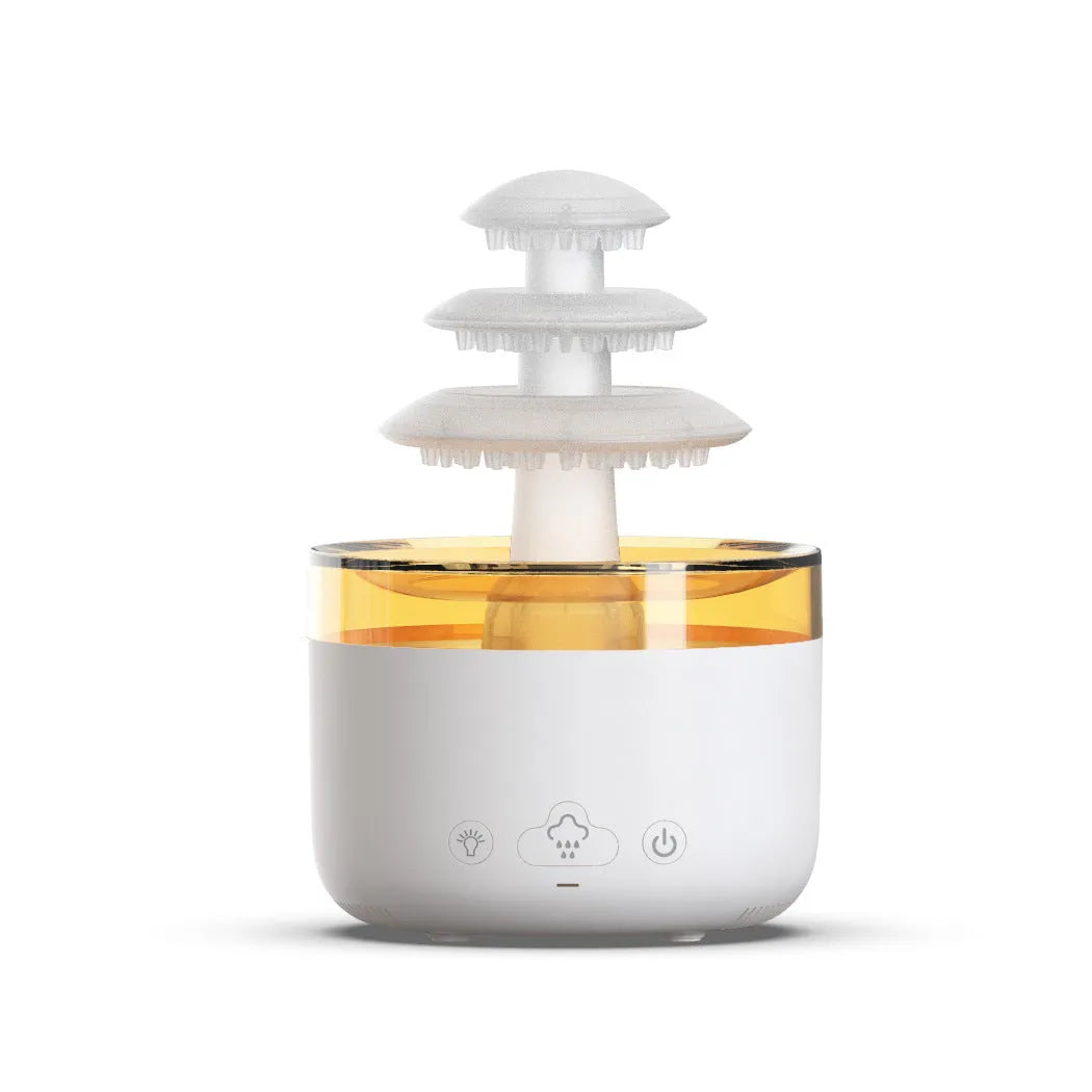 White Cloud Rain ultrasonic humidifier and essential oil diffuser with colourful LED lights on a table.