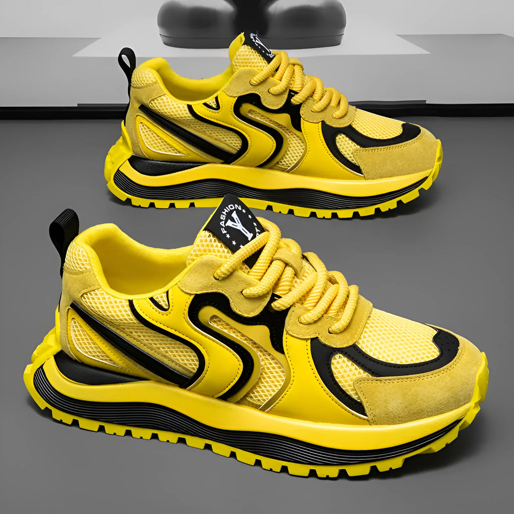 Men's round-toe sneakers in yellow with mesh panels and white laces on a rubber sole.