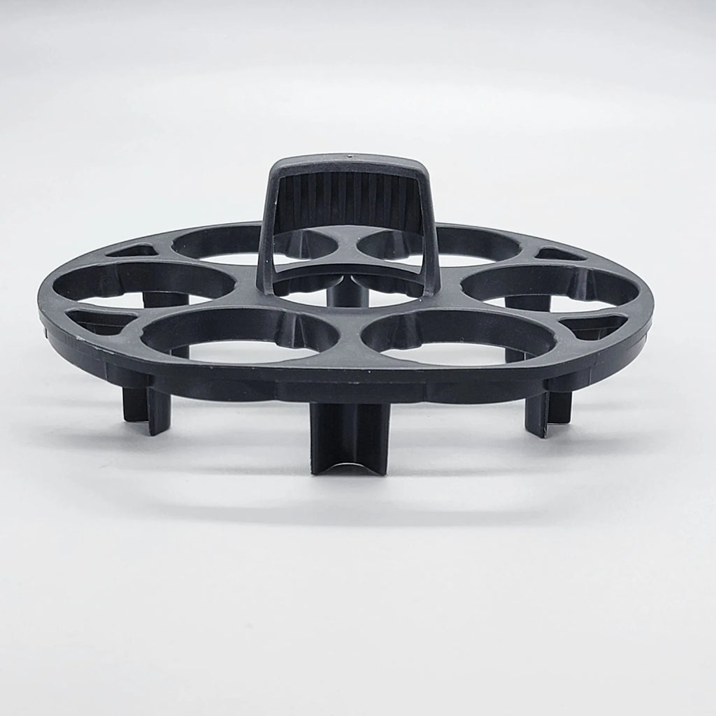 Black plastic egg holder measuring 13.8×12.6×5.7cm with retainer compartments for secure egg storage