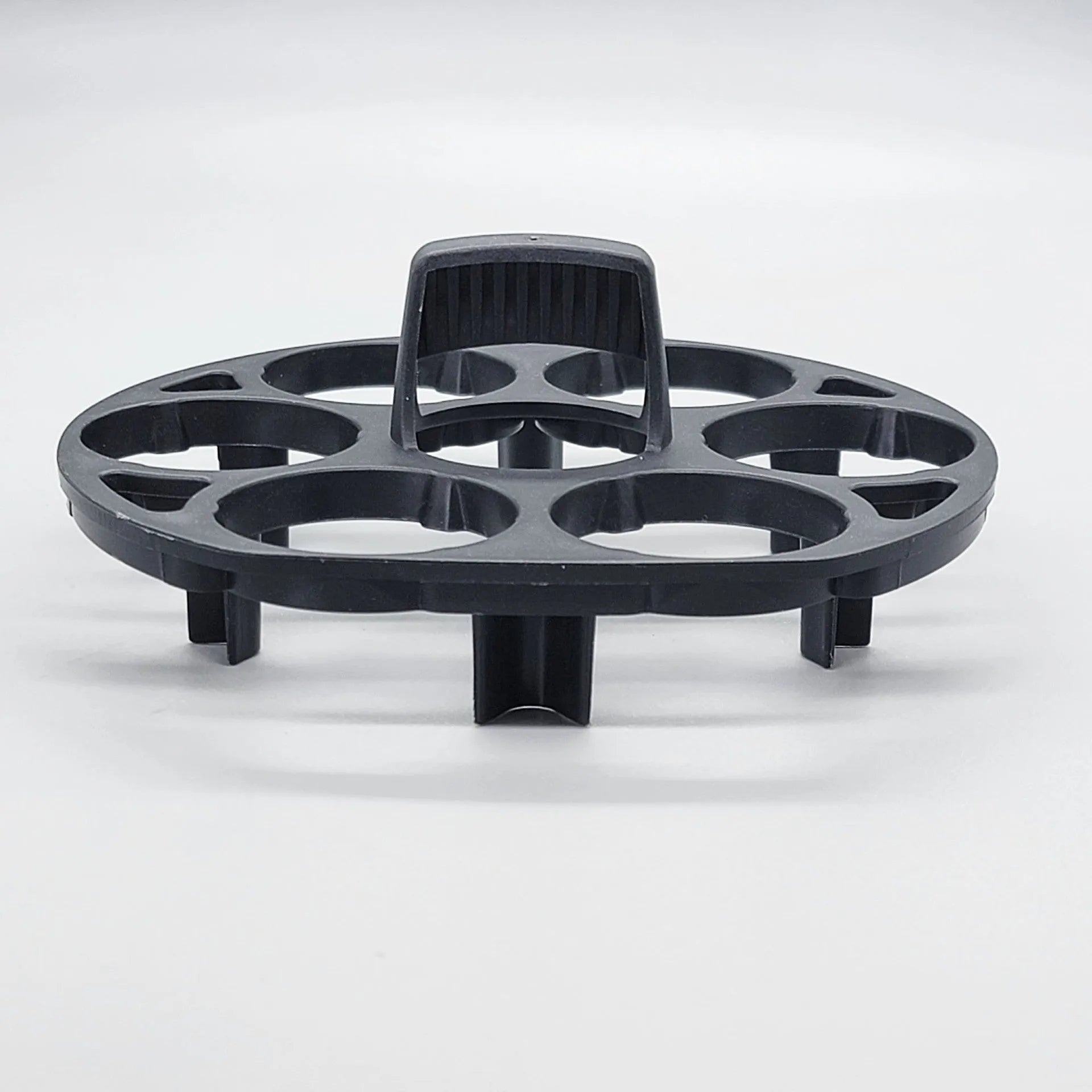 Black plastic egg holder measuring 13.8×12.6×5.7cm with retainer compartments for secure egg storage