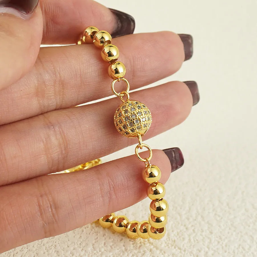Women's copper bracelet with heart shape and round zircon stones in Arabic design style