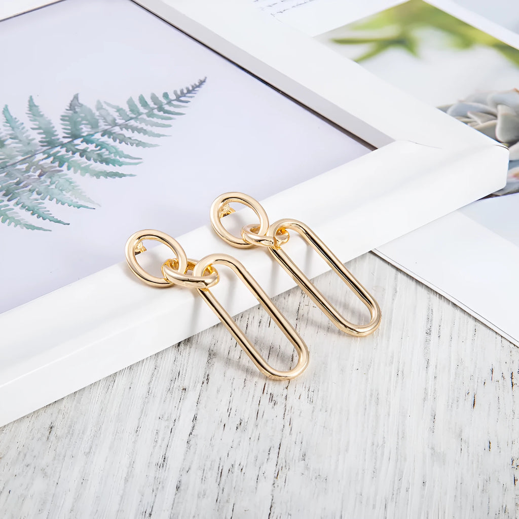 Sterling silver geometric hoop earrings with electroplated finish and needle post design