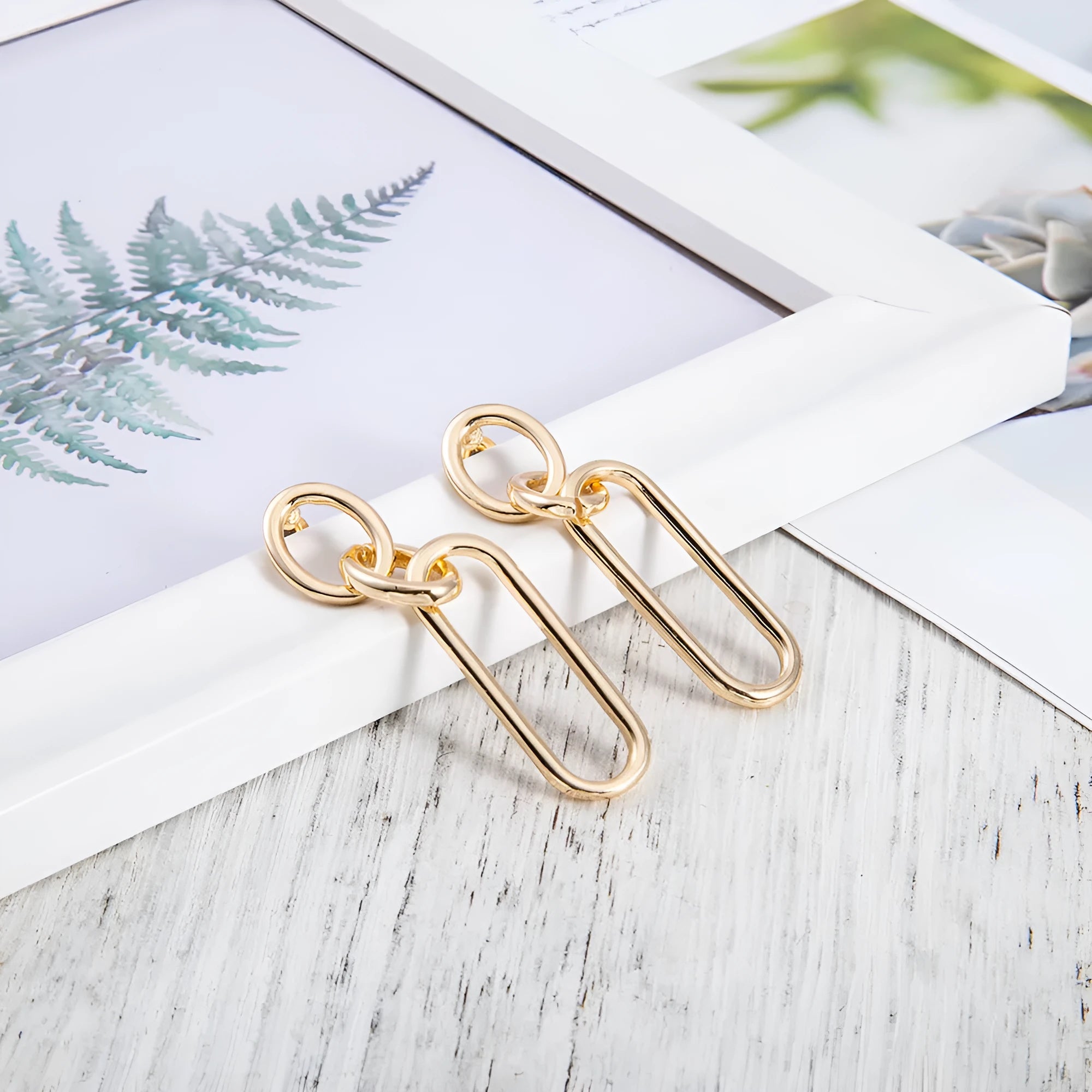 Sterling silver geometric hoop earrings with electroplated finish and needle post design