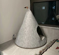 Grey conical felt cat house for indoor cats under 12 pounds.