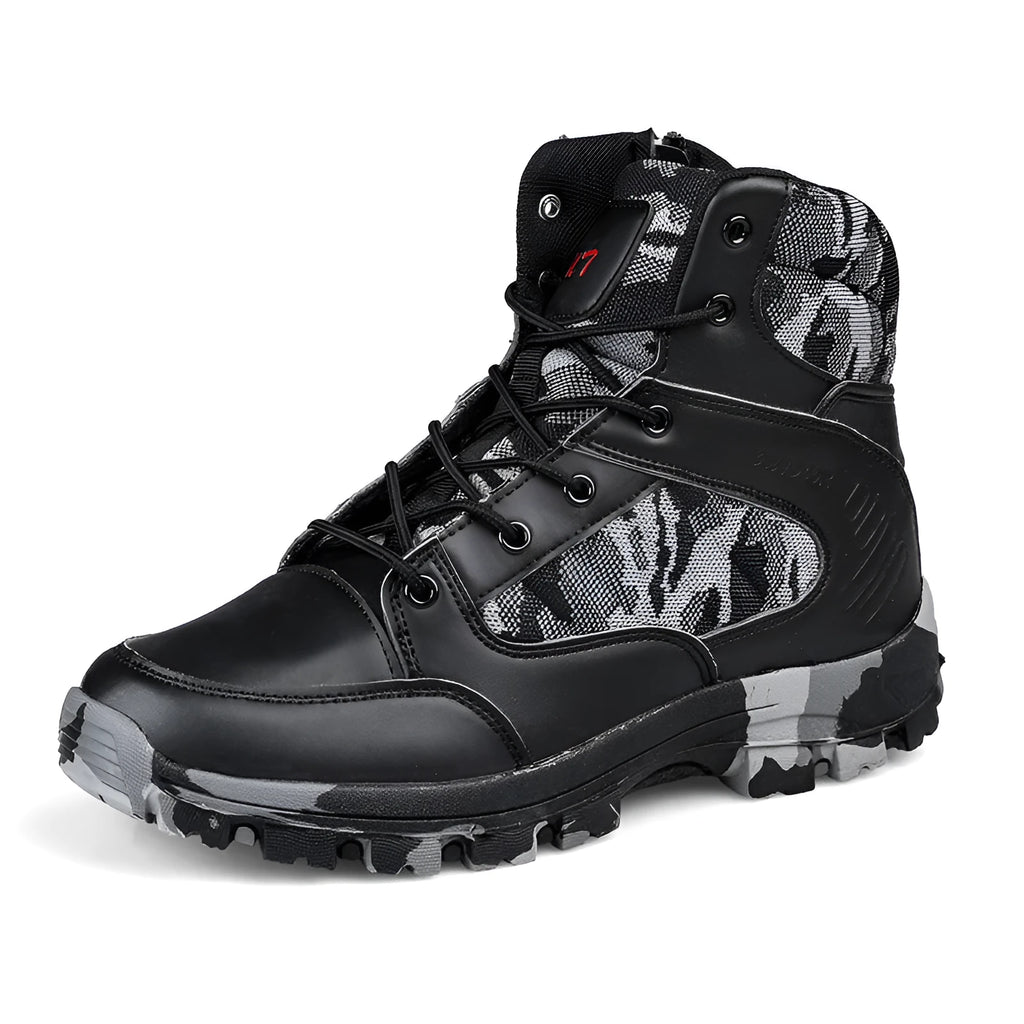 Men's black high-top hiking shoe with metal accents and PU upper on a rocky outdoor path.